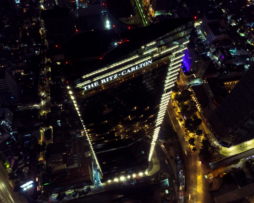 Stunning aerial view of The Ritz-Carlton hotel illuminated at night in Mexico City.