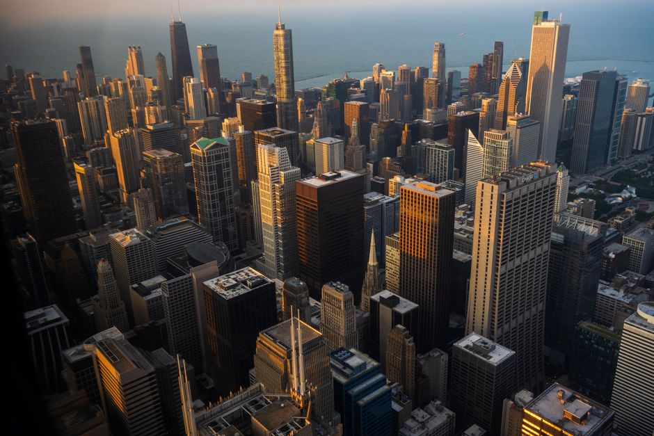 Stunning aerial view of the Chicago skyline at sunset, showcasing skyscrapers and Lake Michigan.