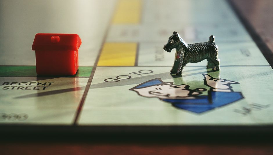 Detailed view of a Monopoly board with tokens on Regent Street.